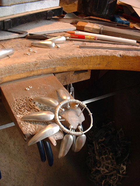 Louise uing a bandsaw to create a new sculpture