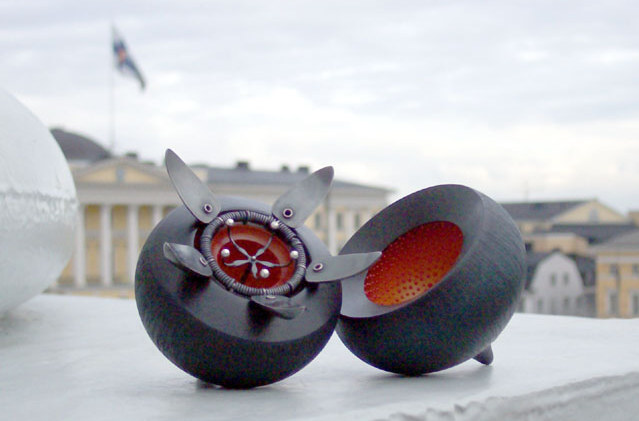 seed pod in front of an ornate building with columns